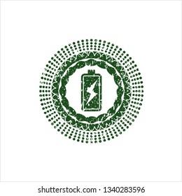 Green battery charging icon inside rubber texture