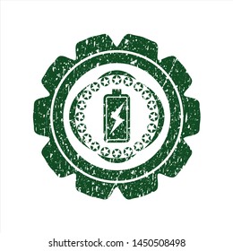 Green battery charging icon inside grunge seal
