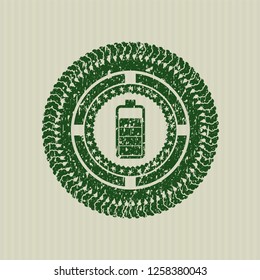 Green battery icon inside distressed rubber grunge texture seal