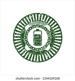 Green battery icon inside rubber grunge texture seal