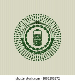 Green battery icon inside rubber seal with grunge texture. 
