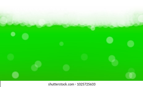 Green beer background for Saint Patricks Day with bubbles and foam.