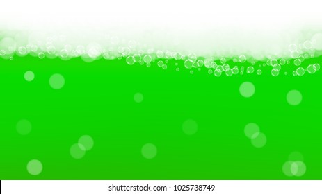 Green beer background for Saint Patricks Day with bubbles and foam.