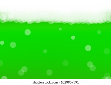 Green beer background for Saint Patricks Day with bubbles and foam.