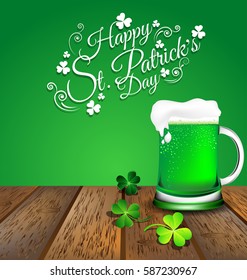 Green beer with Shamrock on wooden floor for St. Patrick's Day card