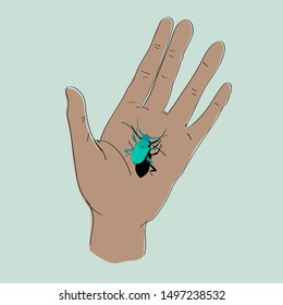 green beetle on the palm. catch luck elusive happiness