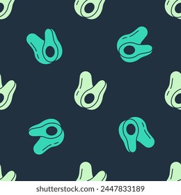 Green and beige Avocado fruit icon isolated seamless pattern on blue background.  Vector