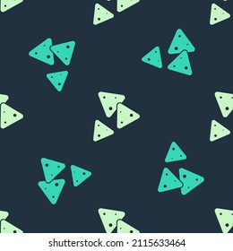 Green and beige Nachos icon isolated seamless pattern on blue background. Tortilla chips or nachos tortillas. Traditional mexican fast food.  Vector