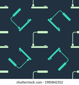 Green and beige Table lamp icon isolated seamless pattern on blue background. Desk lamp.  Vector