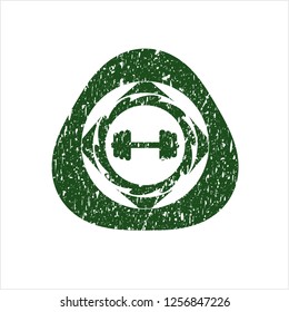 Green big dumbbell icon inside rubber seal with grunge texture