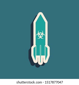 Green Biohazard rocket icon isolated on blue background. Rocket bomb flies down. Long shadow style. Vector Illustration