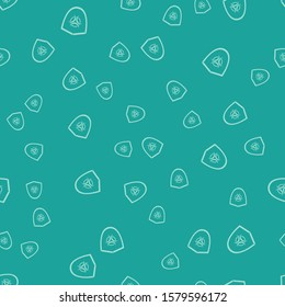 Green Biohazard symbol on shield icon isolated seamless pattern on green background.  Vector Illustration