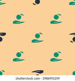 Green and black Apple in hand icon isolated seamless pattern on beige background. Fruit with leaf symbol.  Vector Illustration