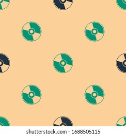 Green und schwarz Symbol für CD oder DVD-Disc einzeln auf beigem Hintergrund. Kompaktes Festplattenzeichen. Vektorillustration-Illustration