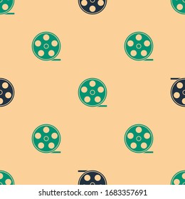 Green and black Film reel icon isolated seamless pattern on beige background.  Vector Illustration