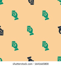 Green and black Hand holding playing cards icon isolated seamless pattern on beige background. Casino game design.  Vector Illustration