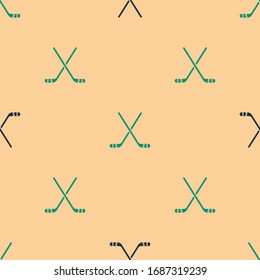 Green and black Ice hockey sticks icon isolated seamless pattern on beige background.  Vector Illustration