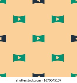 Green and black Online play video icon isolated seamless pattern on beige background. Film strip with play sign.  Vector Illustration