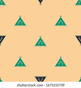 Green and black Traditional indian teepee or wigwam icon isolated seamless pattern on beige background. Indian tent.  Vector Illustration