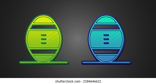 Green and blue American Football ball icon isolated on black background. Rugby ball icon. Team sport game symbol.  Vector