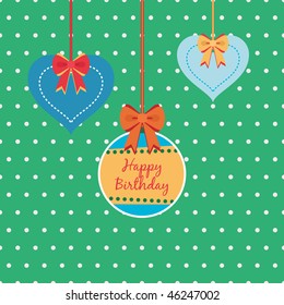 green and blue birthday decorations on polka dot background