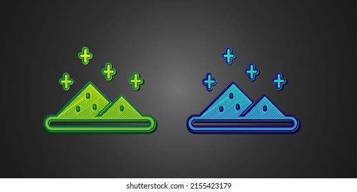 Green and blue Magic powder icon isolated on black background.  Vector