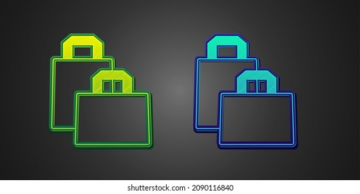Green and blue Paper shopping bag icon isolated on black background. Package sign.  Vector