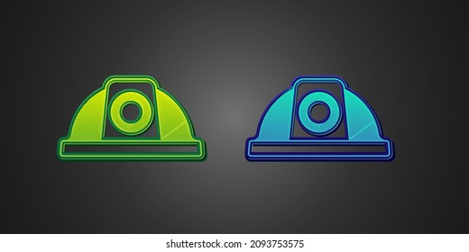 Green and blue Worker safety helmet icon isolated on black background.  Vector