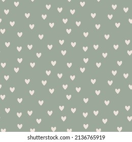 Green boho seamless pattern with small hearts. Cute background in modern bohemian style perfect for scrapbooking, textile, wrapping paper and stationery for kids and adults