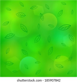 Green bokeh background with leaves