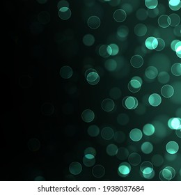 Green bokeh blurred light. Abstract background with bokeh effect. Magic concept.