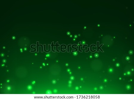 Green bokeh light background. Sparkle effect with particles. Magic overlay dust. Glitter blur texture.