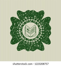 Green book icon inside distressed rubber grunge seal