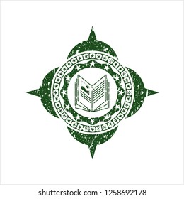 Green book icon inside distressed rubber stamp with grunge texture
