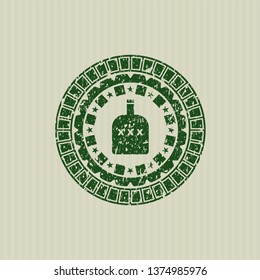 Green bottle of alcohol icon inside rubber seal