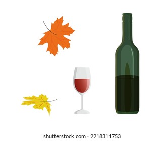 green bottle of red wine with wineglass and orange yellow fall leaves