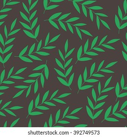Green branches on a brown background. seamless pattern
