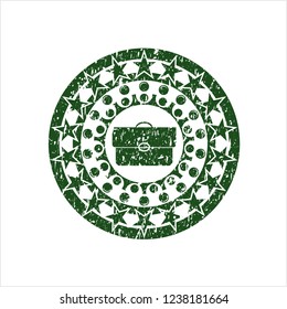 Green briefcase icon inside rubber seal with grunge texture