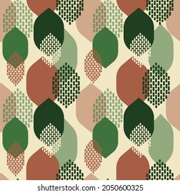 Green and brown abstract leaves on a light beige background. Seamless modern pattern for textiles and paper. Vector.