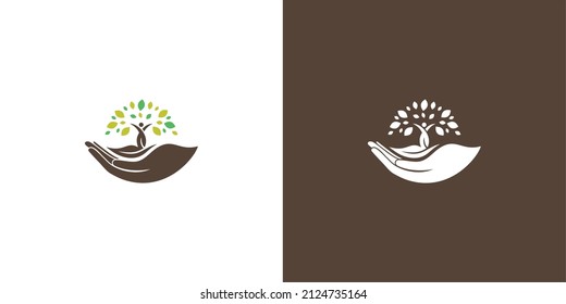 green and brown logo
hand and tree logo