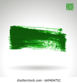 Green brush stroke and texture. Grunge vector abstract hand - painted element. Underline and border design.