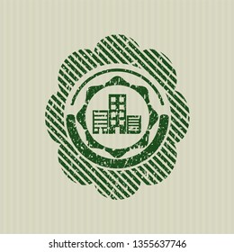 Green buildings icon inside rubber seal with grunge texture