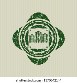 Green buildings icon inside rubber stamp