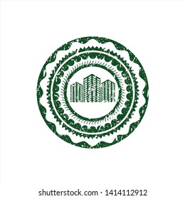 Green buildings icon inside rubber seal with grunge texture