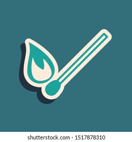 Green Burning match with fire icon isolated on blue background. Match with fire. Matches sign. Long shadow style. Vector Illustration