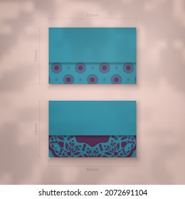 Green business card with vintage purple ornament for your contacts.