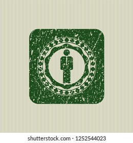 Green businessman icon inside distress rubber seal with grunge texture