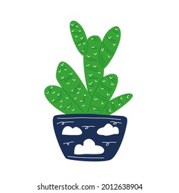 Un cactus verde en una olla azul con nubes pintadas.
