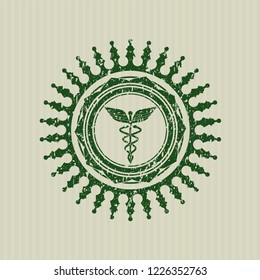 Green Caduceus medical icon inside rubber grunge stamp