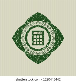Green calculator icon inside grunge seal